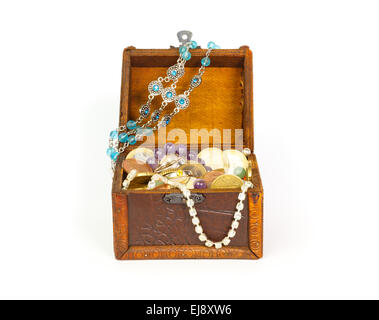 Open treasure chest with bracelets, coins, rings and pearls isolated on white background Stock Photo