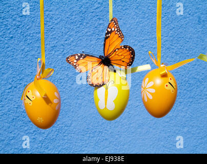 easter eggs with butterfly in blue background Stock Photo