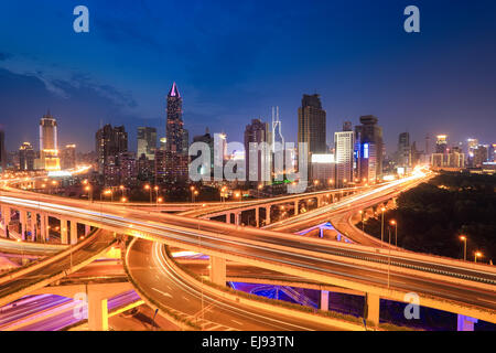 city highway traffic in nightfall Stock Photo