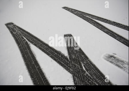 Tire tracks in snow Stock Photo