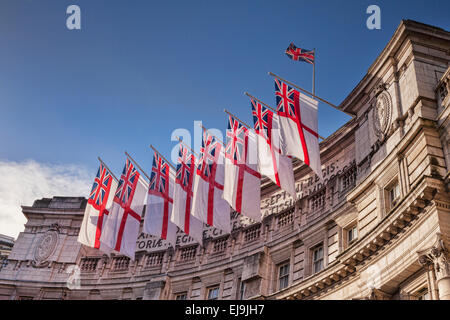 Admiralty Arch flying White Ensigns, the flag of the Royal Navy. Stock Photo