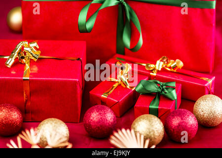 Five Xmas Gifts Wrapped in Plain Red Stock Photo