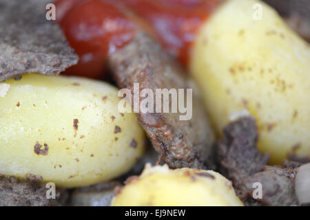 Fried pork liver with tomatoes and potatoes Stock Photo