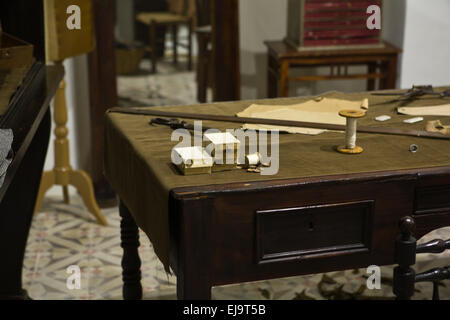 Tailor workshop with sewing accessories on wooden table Badajoz, Spain Stock Photo