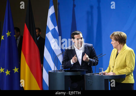 Berlin, Germany. 23rd Mar, 2015. German Chancellor Angela Merkel (R) and Greek Prime Minister Alexis Tsipras attend a joint press conference after their meeting at the Chancellery in Berlin, Germany, on March 23, 2015. German Chancellor Angela Merkel said on Monday that Germany wants a strong Greece with growth and reduced unemployment, while urging Greece to continue structural reforms. © Zhang Fan/Xinhua/Alamy Live News Stock Photo
