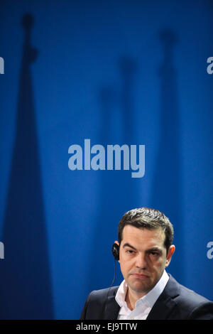 Berlin, Germany. 23rd Mar, 2015. Greek Prime Minister Alexis Tsipras attends a press conference after his meeting with German Chancellor Angela Merkel at the Chancellery in Berlin, Germany, on March 23, 2015. German Chancellor Angela Merkel said on Monday that Germany wants a strong Greece with growth and reduced unemployment, while urging Greece to continue structural reforms. © Zhang Fan/Xinhua/Alamy Live News Stock Photo