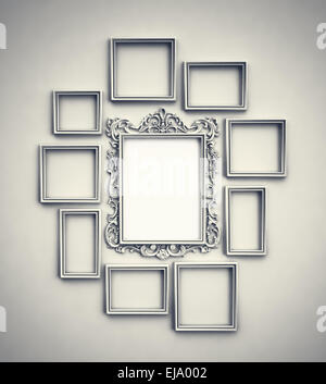 Wall with simple frames surrounding ornamented frame in the middle Stock Photo