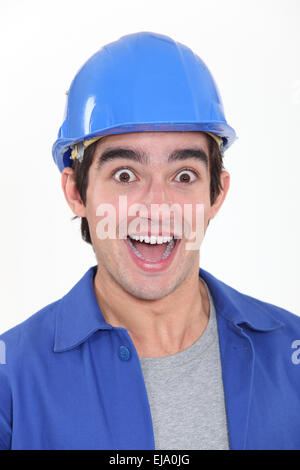 portrait of young tradesman playing the fool Stock Photo