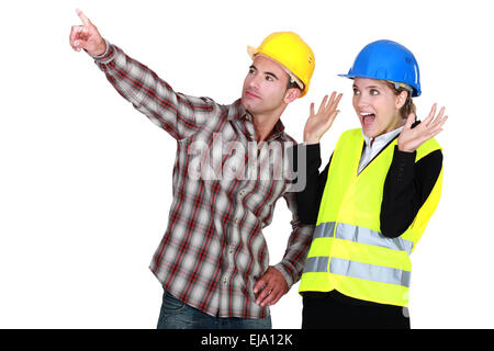craftsman showing something good to a businesswoman Stock Photo