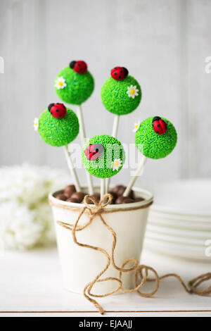 Cake pops decorated with fondant ladybugs Stock Photo