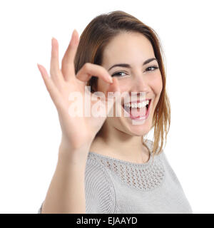 Close up of a happy woman making ok gesture isolated on a white background Stock Photo