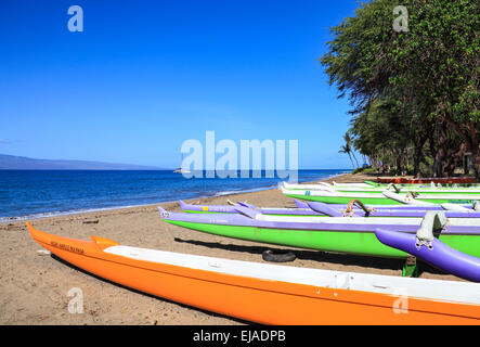 Outrigger canoes at Canoe Beach, viewed looking north toward Kaanapali Stock Photo