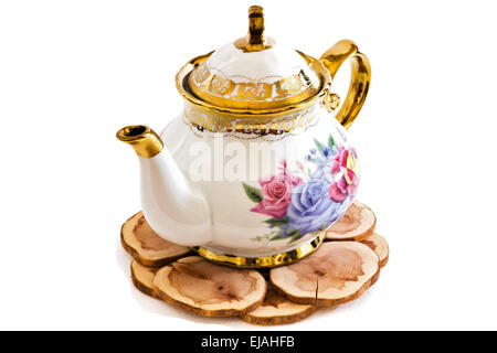 Ceramic teapot on Wooden stand . Stock Photo