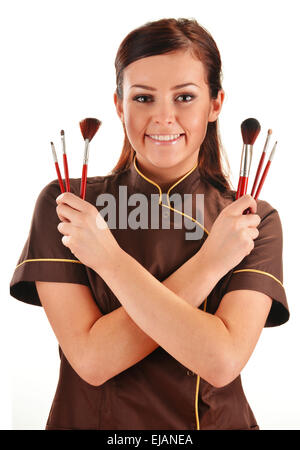 Professional beautician holding brushes Stock Photo