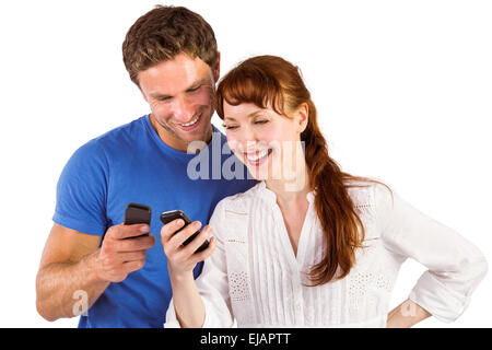 Couple using their mobile phones Stock Photo