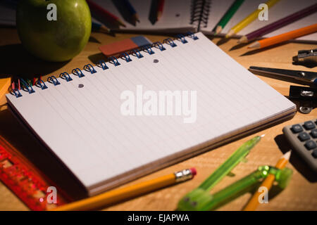 Students table with school supplies Stock Photo