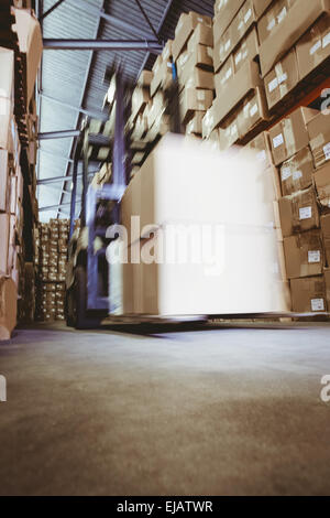 Forklift in large warehouse Stock Photo