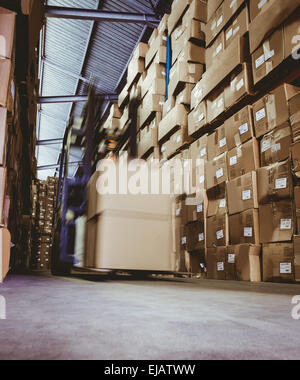 Forklift in large warehouse Stock Photo