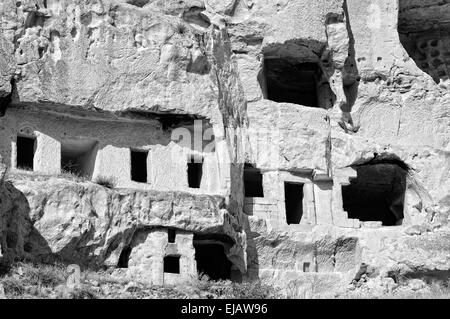 Cavusin carved into cave houses Turkey Stock Photo