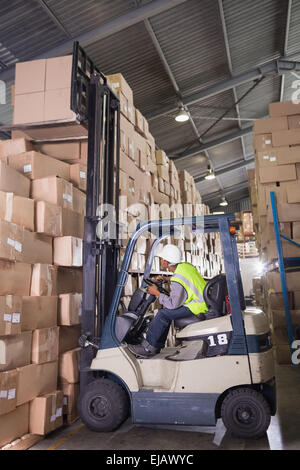 Forklift machine in warehouse Stock Photo