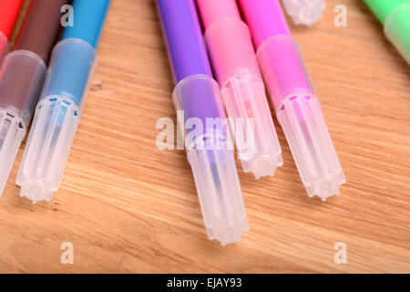 Blank notebook with many color markers on wooden table. The view from the top Stock Photo