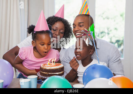 Happy family celebrating a birthday together Stock Photo