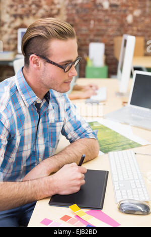 Male photo editor using digitizer in office Stock Photo