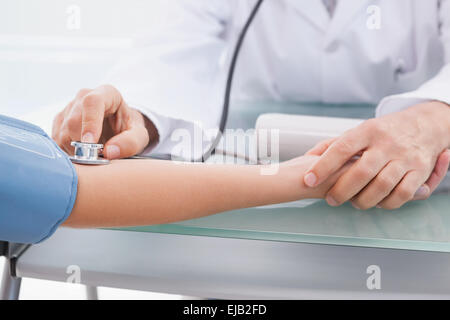 Doctor doing test at his patient Stock Photo