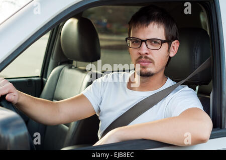 Male caucasian serious driver in a car Stock Photo