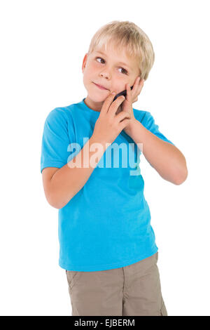 Cute little boy talking on smartphone Stock Photo