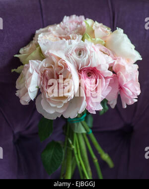 Bouquet of roses and ranunculus in tin container on Paris apartment balcony Stock Photo