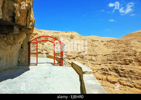 The red gate  on a mountain road Stock Photo