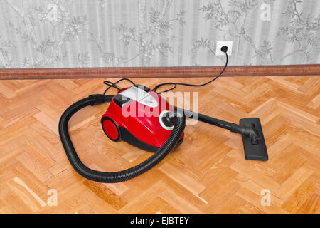 Vacuum cleaner on parquet Stock Photo