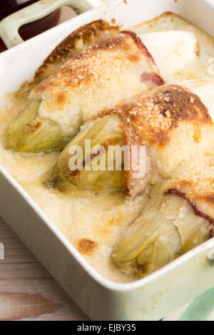 chicory baked with bacon and cheese Stock Photo