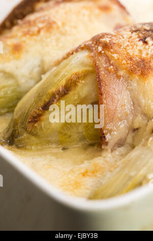 chicory baked with bacon and cheese Stock Photo
