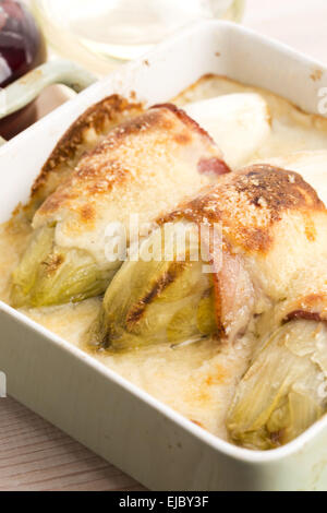 chicory baked with bacon and cheese Stock Photo