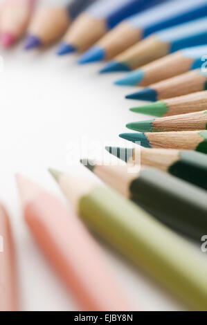 Colored pencils in a semicircle on paper Stock Photo