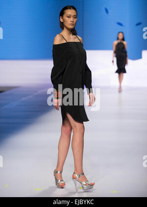 Beijing, China. 23rd Mar, 2015. A contestant performs during the 10th China Super Model Final Contest in Beijing, capital of China, March 23, 2015. Credit:  Li Jianbo/Xinhua/Alamy Live News Stock Photo