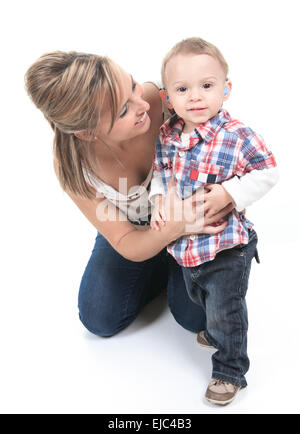 Mother with son. The kid have a Hearing Aids. Stock Photo