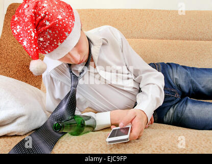 Drunken Teenager in Santa Hat Stock Photo