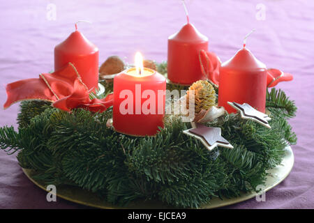 Burns first candle in the Advent wreath Stock Photo