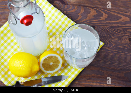 Still life photo of old fashioned or traditional homemade sour lemonade from an old style glass bottle. Stock Photo