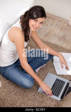 Young girl using a laptop Stock Photo