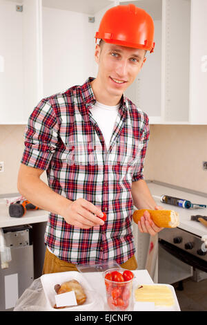 workman dines Stock Photo