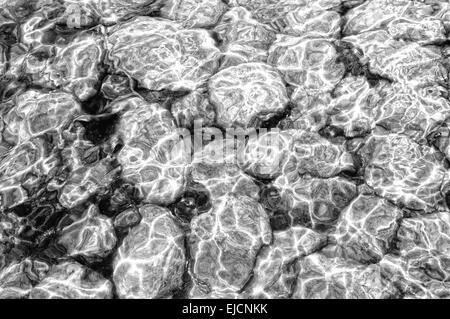 Stones covered with net black and white Stock Photo