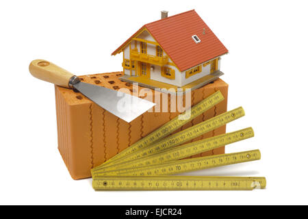 model house on construction plan with tools Stock Photo