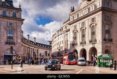 A taxi cab and a London bus at the entrance to Regent Street, London, England, UK. Stock Photo