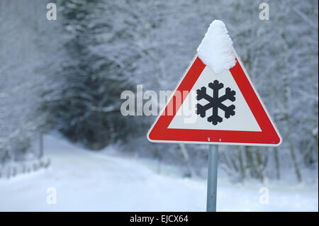 warning sign of ice and snow in winter Stock Photo