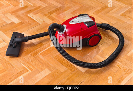 Vacuum cleaner on parquet Stock Photo