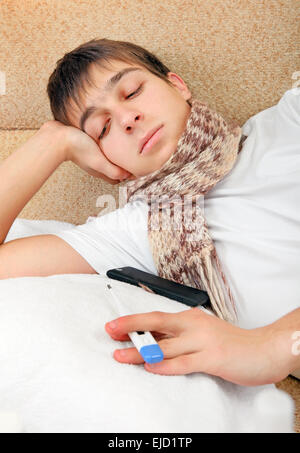 Sick Teenager with Thermometer Stock Photo